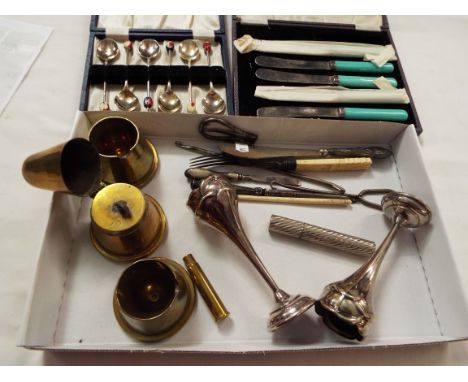 A pair of silver-plated bud vases, shoe horn, button hook, trench art light and two ashtrays