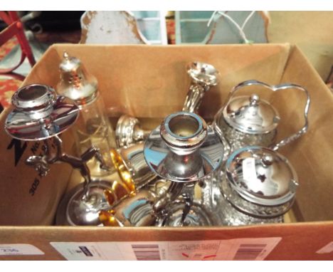 A selection of silver plated ware to include a pair of art deco figural candlesticks pair of posy vases, preserve post, stand