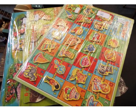 A vintage 'Victory' childs wooden alphabet jigsaw together with two similar J.W. Spear & Sons childs wooden jigsaws