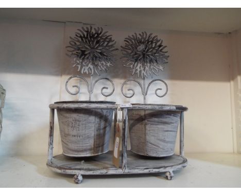 A free standing metal two potted planter 