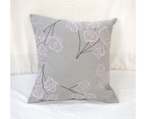 HAND MADE EMBROIDERED CUSHION BY JANICE HUTCHESONin linen, the dark grey and lilac embroidery depicting roses, with ceramic b