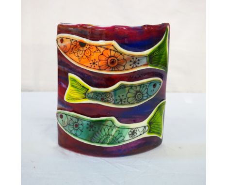 FREESTANDING HAND-MADE GLASS CANDLE SHADEthe hand-made red glass candle shade featuring fish decorated with flowers, 20cm wid