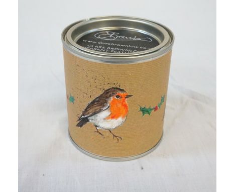 CLARE BROWNLOW SCENTED CANDLEwith the festive scent of Lichen Berry, in a tin decorated with Robins and hollyNote: Clare Brow