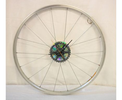 BICYCLE WHEEL WALL-CLOCK BY SALVATION BARMYa wall-clock created utilising a bicycle wheel, 52cm diameterNote: At Salvation Ba