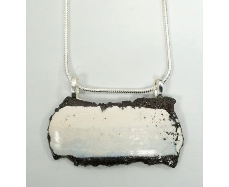 CERAMIC SEASCAPE PENDANT BY EC CERAMIC DESIGNof pale blue and white design, on silver marked chain, with boxNote: Eleanor Cai