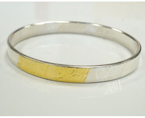 LACE BANGLE BY MARION KANEin Sterling silver and 23 1/2 carat gold foil. If you are the successful bidder of this item and re