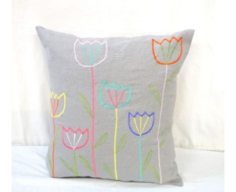 HAND MADE EMBROIDERED CUSHION BY JANICE HUTCHESONin linen, the multi coloured embroidery depicting tulips, with ceramic butto