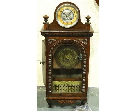 Swiss Symphonium in a walnut case with surmounted chiming clock, nine discs in total, working at lotting. Not available for i
