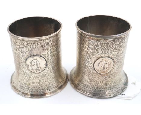 Pair of hallmarked silver stands with engine turned decoration and engraved with the letter D, H: 50 mm, combined 106g. P&amp
