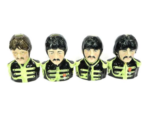 Set of four limited edition The Beatles head character jugs, each H: 13 cm, no cracks or chips. P&amp;P Group 2 (£18+VAT for 