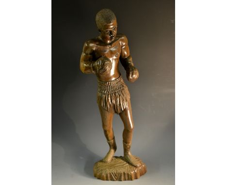 Folk Art - a Colonial hardwood figure, carved as a boxer, he stands, ready for combat, 52cm high