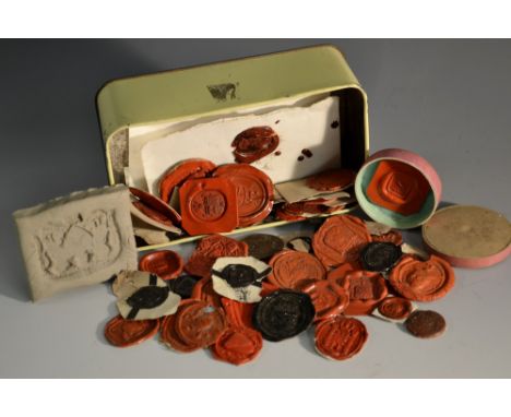 A collection of armorial wax seal impressions, crests and coat of arms, some with various collector's annotations, including 