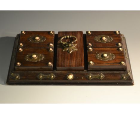 A 19th century Rosewood playing card waiter, fitted with four rectangular boxes centred by a brass handle, applied with Gothi