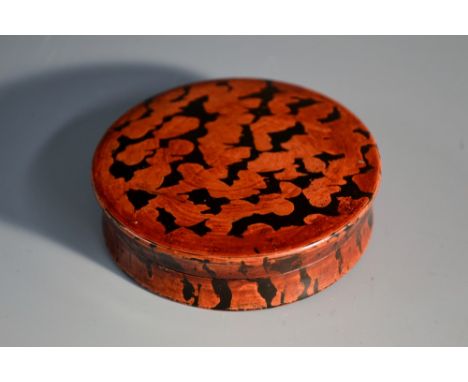 An early 19th century papier-mâché waisted circular snuff box, decorated in tones of mottled tortoiseshell, 7.5cm diam, c.183