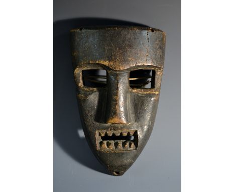 Tribal Art - a Chokwe mask, of typical form, with rectangular eyes, broad nose and angular teeth, 22.5cm long, Angola 
