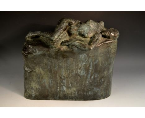 English School (20th century), a verdigris faux bronze maquette, of a sleeping female nude, recumbent on a rocky outcrop, imp
