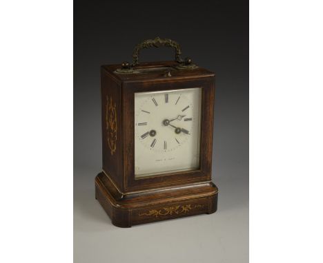 A 19th century French rosewood and marquetry mantel clock, rectangular case on plinth, marquetry inlaid leafy scrolls  to sid