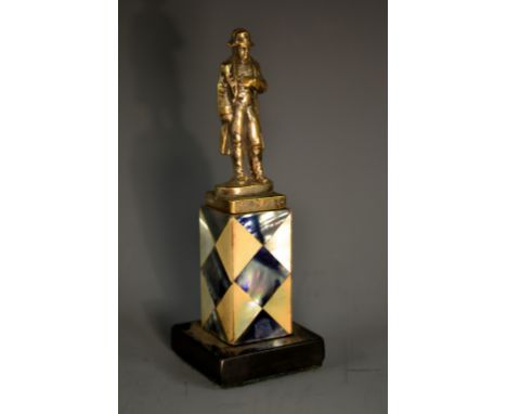 A 19th century silvered desk model, of Napoleon, the plinth veneered overall with mother-of-pearl and abalone, square black m