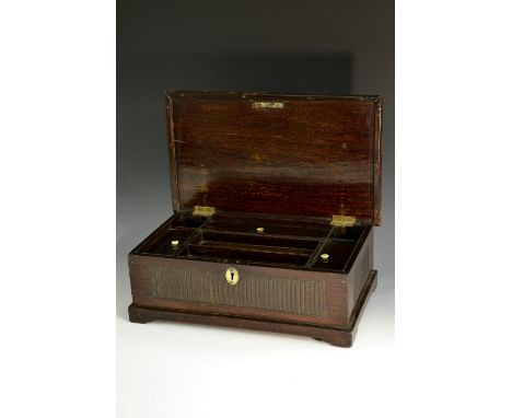 A 19th century Anglo-Indian hardwood clerk's box, hinged cover enclosing well apertures, a lift-out tray and three lidded com