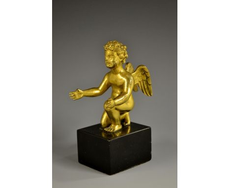 English School (19th century), a gilt cabinet bronze, of a kneeling putto, black marble base, 10cm high