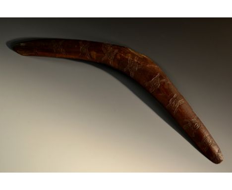 Tribal Art - an Australian Aboriginal boomerang, stone carved motifs, 62cm wide, 19th century 