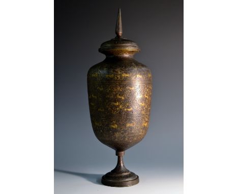 A 19th century Persian ovoid vase and cover, chased with stylised beasts amongst flowers and scrolling foliage, domed cover w
