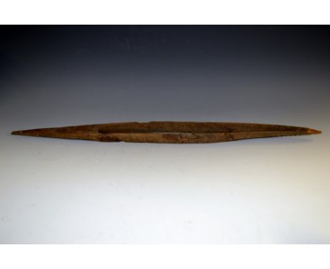 Tribal Art - a hardwood model of a canoe, carved with geometric motifs, 79cm high, probably Polynesian and 19th century 