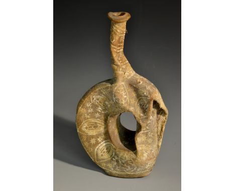A Middle Eastern 'mummified' hide or skin 'moon' flask, probably from a goat, desert/sand preserved, traces of white and ochr
