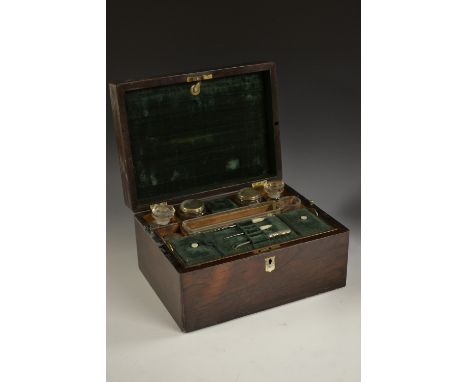 A Victorian rosewood dressing box, hinged cover enclosing lift-out tray and arrangement of jars, bottles, compartment and acc
