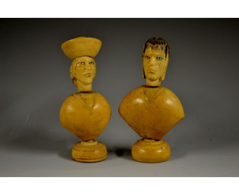 A pair of South American vegetable ivory portrait busts, of gentlemen in native dress, domed bases, 11.5cm high, early 20th c