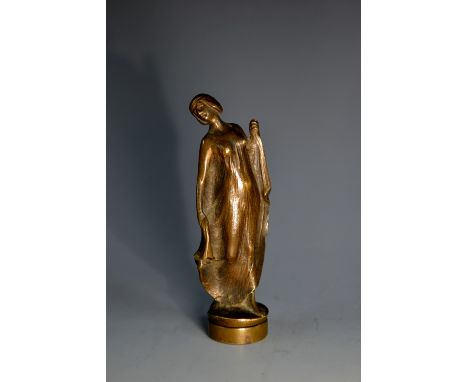 An Art Nouveau desk seal, the grip boldly cast as a draped lady, circular matrix, 7cm long, c.1910