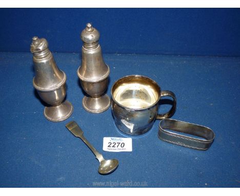 A small christening cup marked 'sterling' to base and a vintage Duchin Creation sterling salt &amp; pepper pot plus spoon and