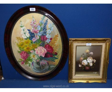 A vintage oval Oil painting of flowers in vase together with a smaller floral still life, signed S. Leigh.