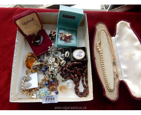 A quantity of costume jewellery to include; brooches, clip on earrings, embroidered scarf ring, etc.