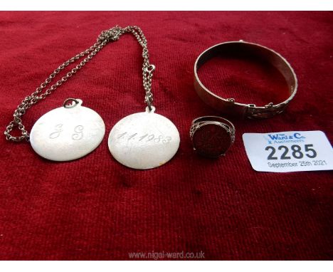 Two silver plain medals/dog tag with chain inscribed 11-1983, silver bangle and a silver sixpence ring.