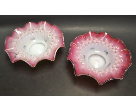 A pair of 19th century Continental glass blush dishes, wavy rim, stipple decoration in relief, enamel and gilded flowers and 