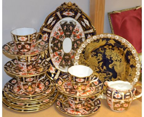 A Royal Crown Derby Imari 2451 tea service comprising, three tea plates four side plates, five cups and saucers, milk jug etc