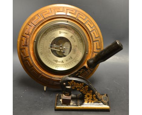 A Shaw & Sons Ltd, engravers stationers letter stapler decorated with gold painted flowers on a black ground;  an oak baromet