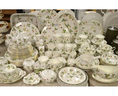 A Wedgwood Wild Strawberry dinner service comprising, meat plate, dinner plates, side plates, cake plate, teapot, cups and sa