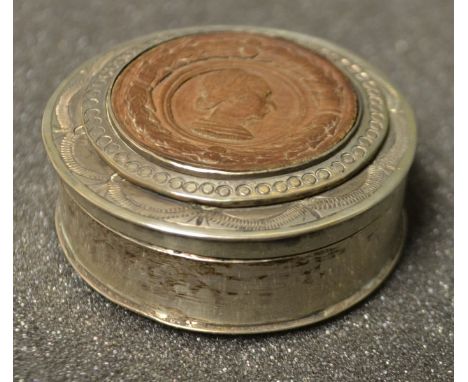 A continental silver snuff box with carved wooden portrait 