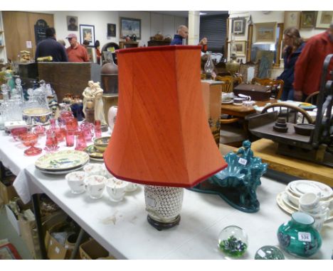 Oriental style blanc de chine lamp on a hardwood base with shade
