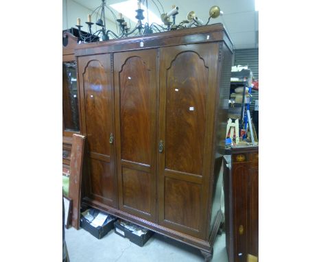 Early 20th century Flamed Mahogany Triple Wardrobe, two panel doors open to reveal hanging cupboard and the other panel door 