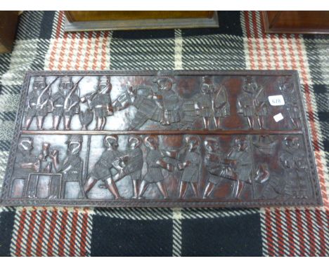 Hardwood tribal carved panel depicting combat moves  