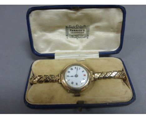 Ladies vintage yellow metal watch in Harrods case