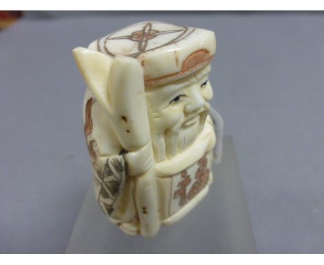 Signed bone netsuke of an old man with stake and scroll     