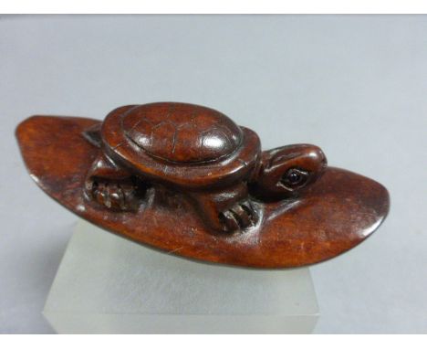 Wooden netsuke of a Turtle on stand     