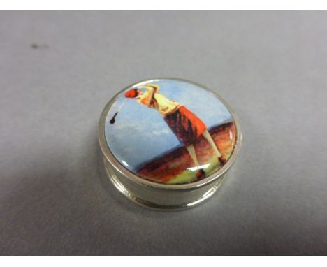 Silver lidded box inset with enamel image of a golfer