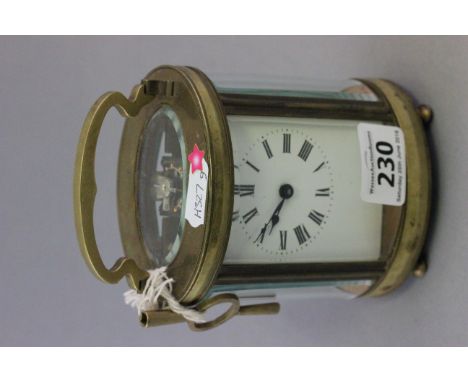Early 20th century Oval Cased Carriage Clock with receipt for repairs