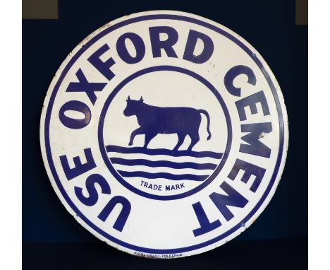 A large blue and white enamel sign 'Use Oxford Cement', signed to the bottom 'Barltrop, Oxford' (61cm diameter)