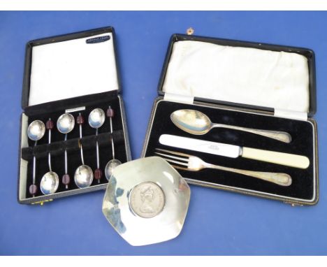 Cased silver comprising a set of six coffee bean handled coffee spoons; a knife, fork and spoon set (the knife with stainless